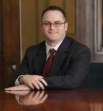 Mr. Andrew Coyne Curley