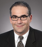 Alan M Feld
