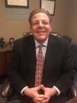 Mr. Brett A. Schneider