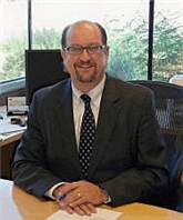 Mr. Christopher J Brelje