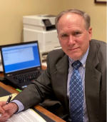 Mr. Christopher L. Peck