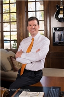James E. Girards
