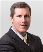James E. Huggett