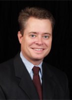 Mr. Mark E. Dykes