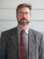 Paul E Quade