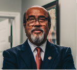 Mr. Richard E. Carrizales