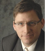 Mr. Scott E. Herrick